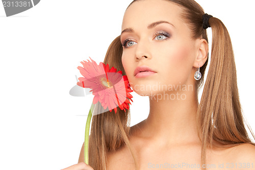 Image of woman with red flower