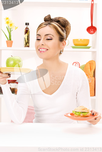 Image of woman with green apple and sandwich