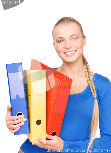 Image of young attractive businesswoman with folders