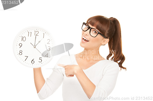 Image of woman holding big clock