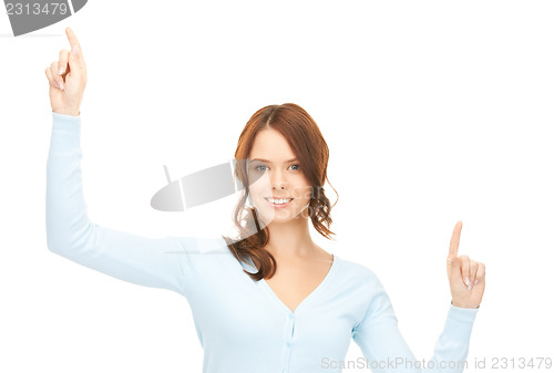 Image of businesswoman working with something imaginary
