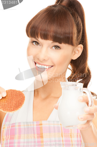 Image of housewife with milk and cookies