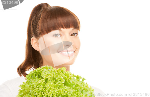 Image of beautiful housewife with lettuce over white