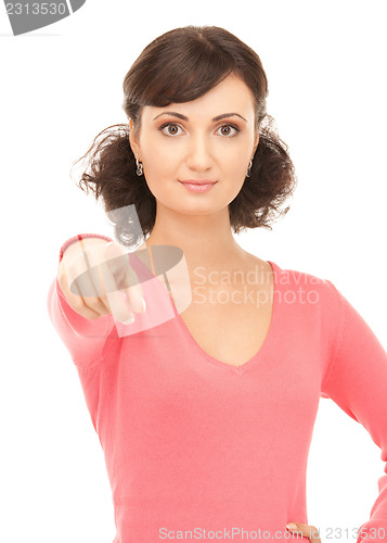 Image of attractive businesswoman pointing her finger