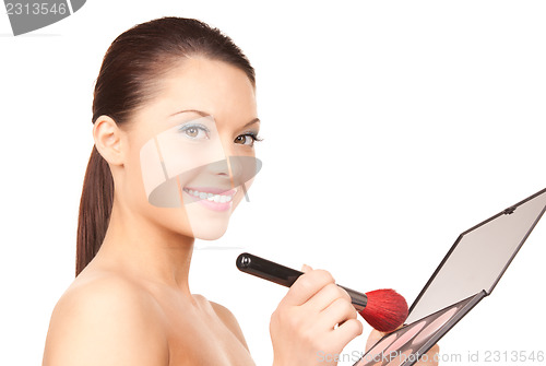 Image of lovely woman with palette and brush