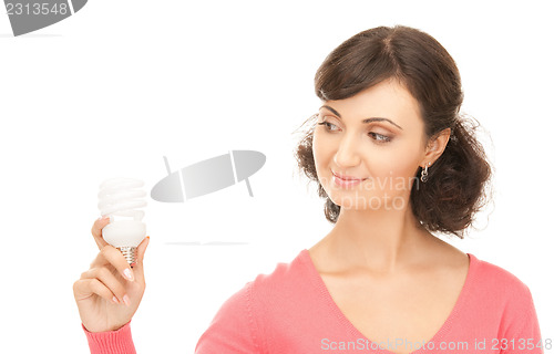 Image of woman holding energy saving bulb