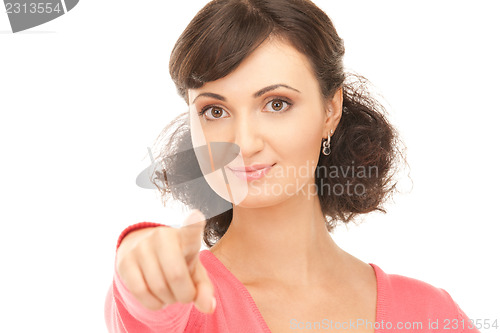 Image of attractive businesswoman pointing her finger