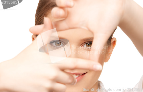 Image of lovely woman creating a frame with fingers
