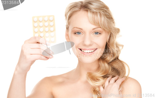 Image of young woman with pills