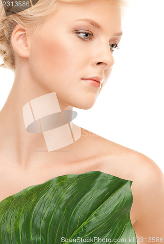 Image of woman with green leaf