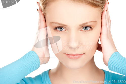 Image of woman with hands on ears