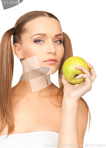 Image of young beautiful woman with green apple