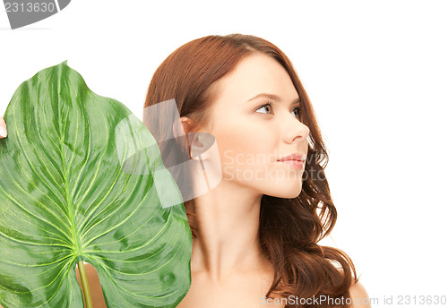 Image of woman with green leaf