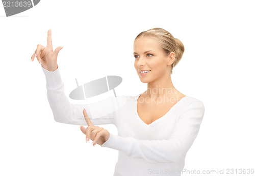 Image of businesswoman working with something imaginary