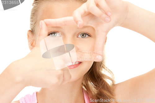 Image of pretty girl creating a frame with fingers