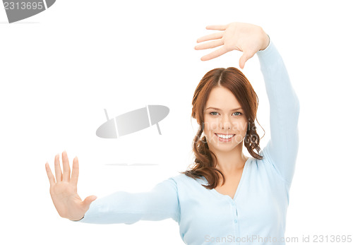 Image of businesswoman working with something imaginary