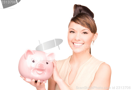 Image of lovely woman with piggy bank