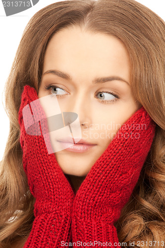 Image of beautiful woman in red mittens 