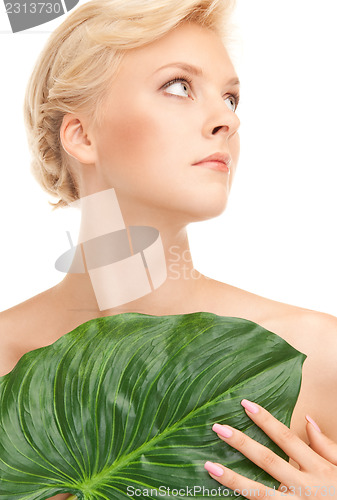 Image of woman with green leaf
