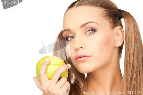 Image of young beautiful woman with green apple