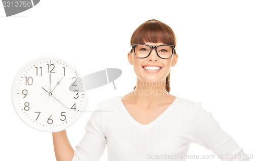 Image of woman holding big clock