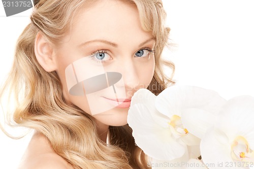 Image of beautiful woman with white flower