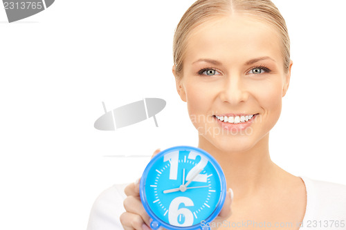 Image of woman holding alarm clock