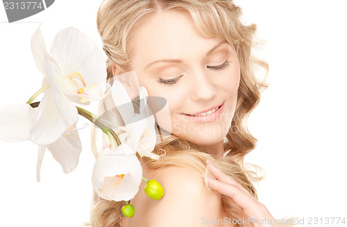 Image of beautiful woman with white flower