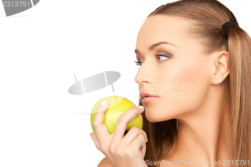 Image of young beautiful woman with green apple