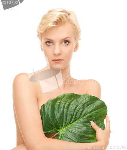 Image of woman with green leaf