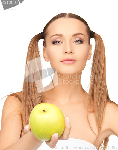 Image of young beautiful woman with green apple