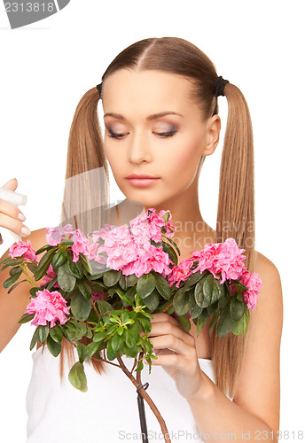 Image of lovely housewife with flowers