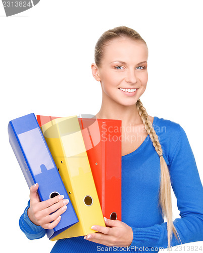 Image of young attractive businesswoman with folders