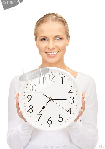 Image of woman holding big clock