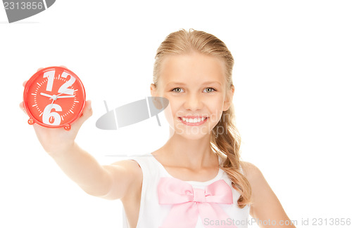 Image of girl holding alarm clock