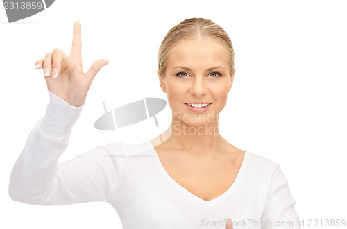 Image of businesswoman working with something imaginary