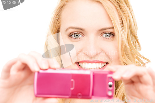 Image of happy woman using phone camera