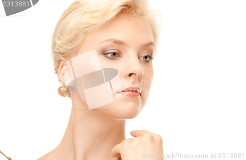 Image of lovely woman with twig
