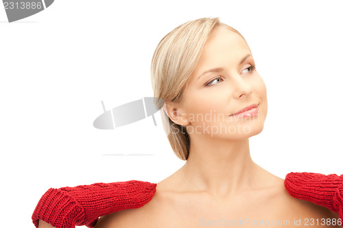 Image of beautiful woman in red mittens 