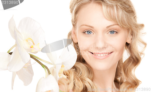Image of beautiful woman with white flower