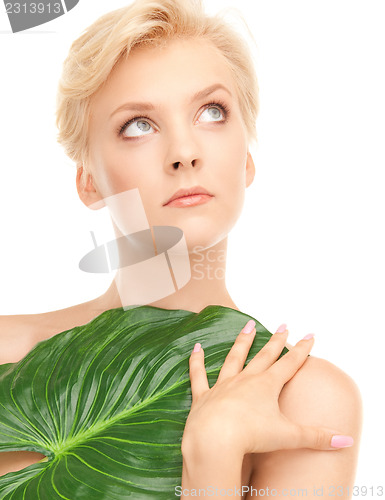 Image of woman with green leaf