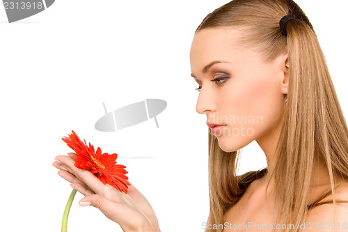 Image of woman with red flower