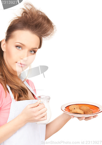 Image of housewife with milk and cookies