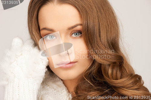 Image of beautiful woman in white gloves