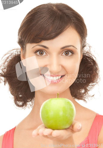 Image of young beautiful woman with green apple