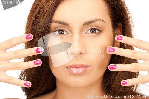 Image of lovely woman with polished nails 