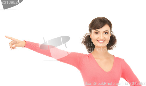 Image of attractive businesswoman pointing her finger