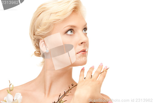 Image of lovely woman with twig