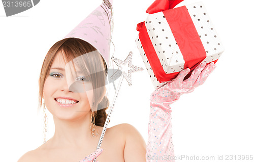 Image of teenage party girl with magic wand and gift box