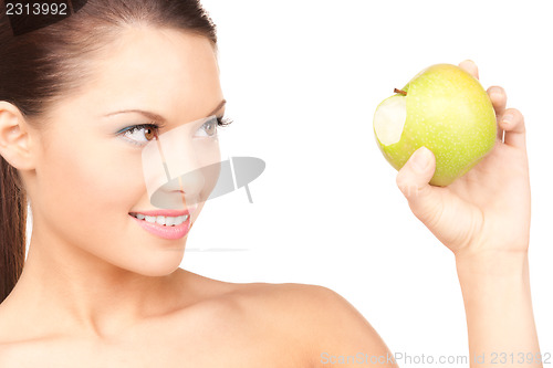 Image of young beautiful woman with green apple